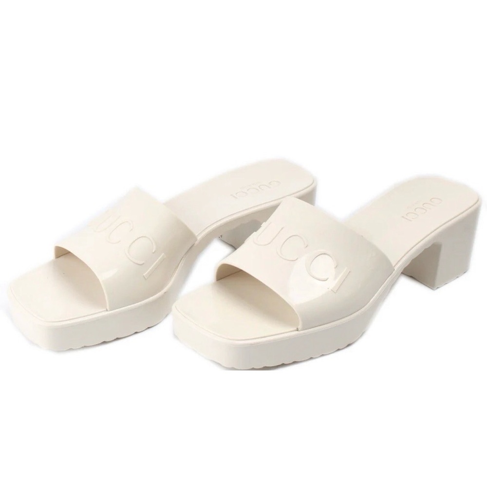 Gucci rubber block low-heel slide sandals in off-white or mystic white.